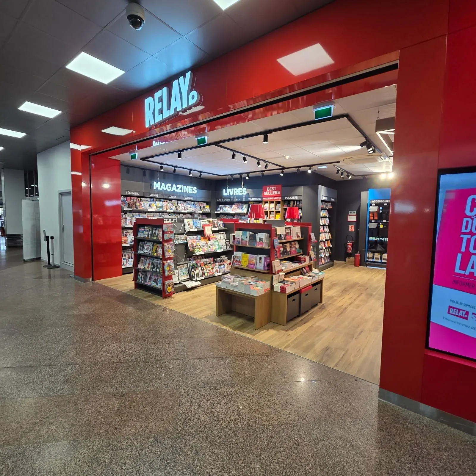 Boutique Relay with vibrant red wall marking